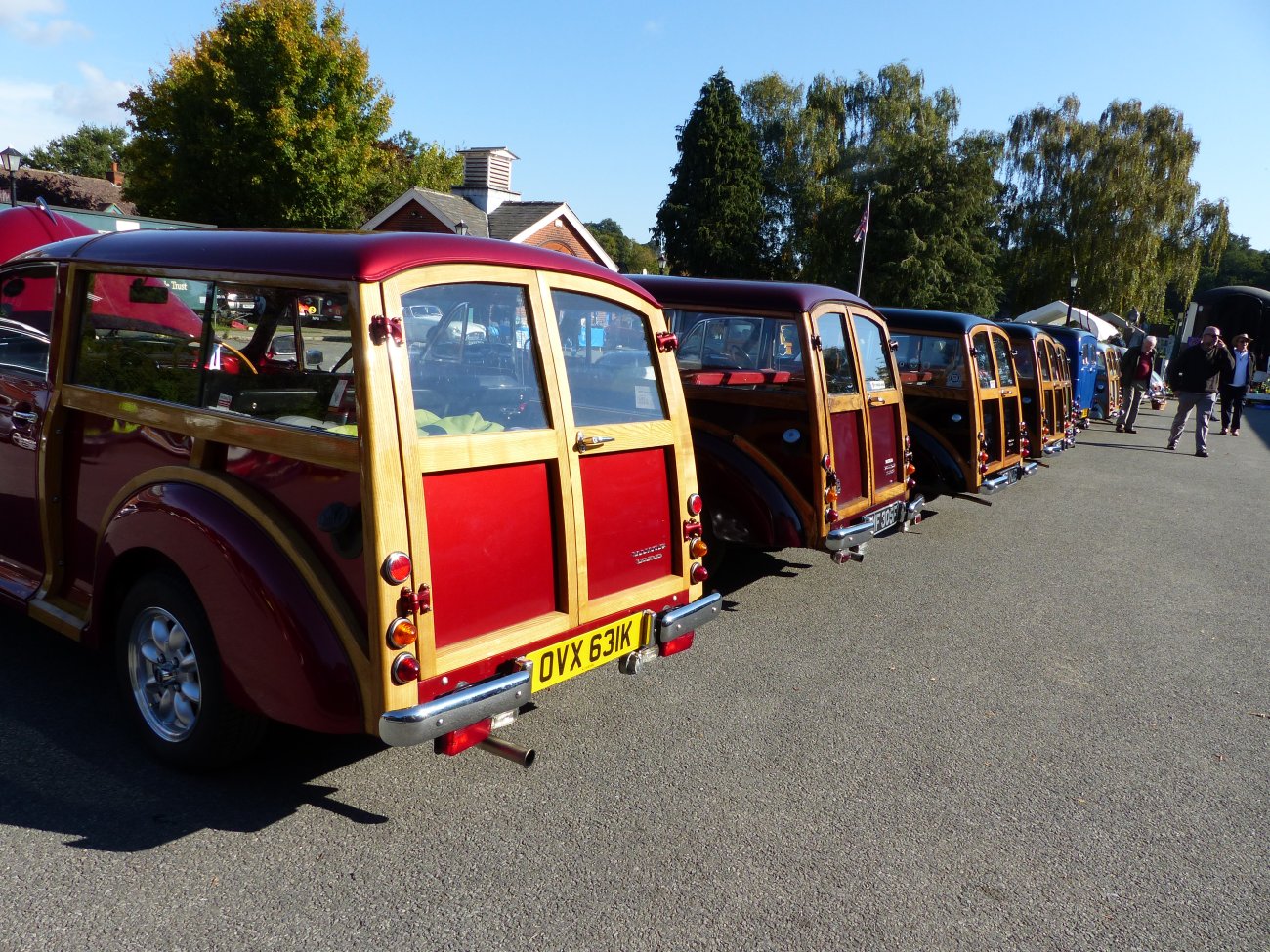View of the back of multiple Morris Minors in Whitewebbs Museum's carpark at an event